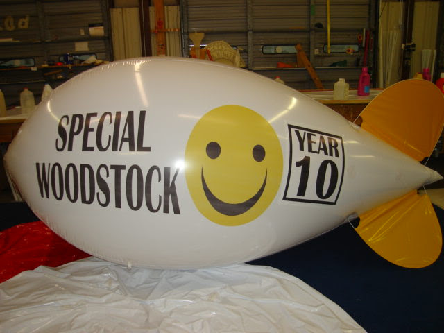 10 ft white polyurethane advertising blimp with WoodStock 10 year anniversary logo